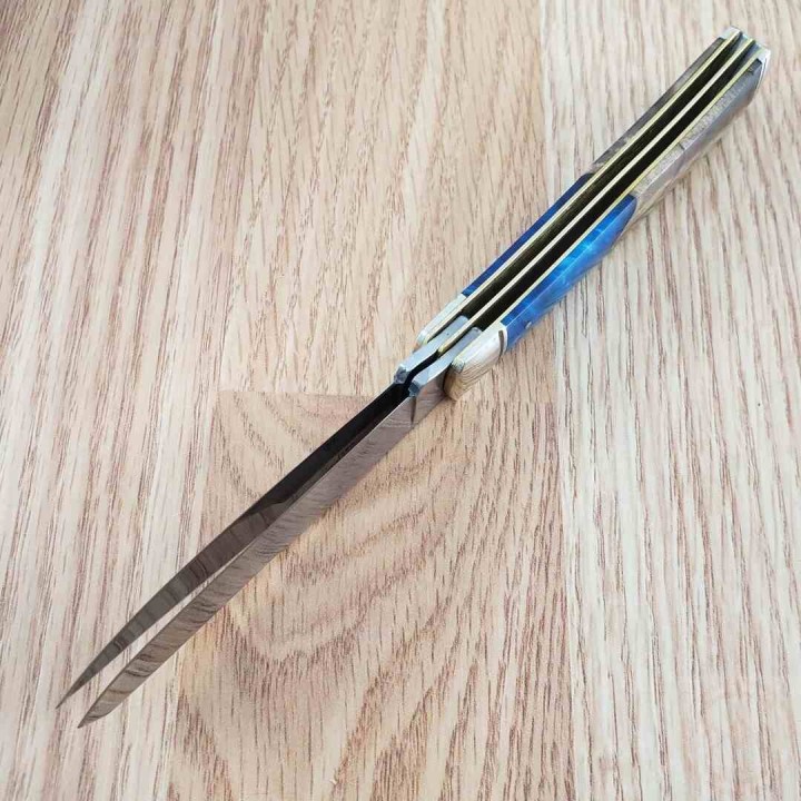 Couteau Rough Rider Pandora Swirl Trapper Lames Clip Point Spey Acier 440 Manche Bois et Résine RR2656 -  Livraison Gratuite