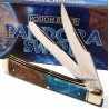 Couteau Rough Rider Pandora Swirl Trapper Lames Clip Point Spey Acier 440 Manche Bois et Résine RR2656 - Livraison Gratuite