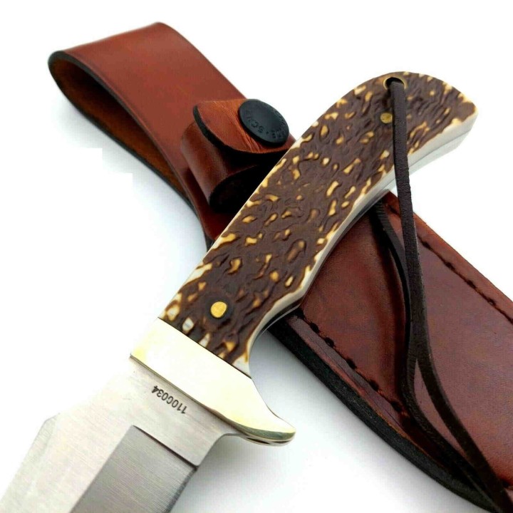 Couteau Schrade Uncle Henry Skinner Acier 7Cr17MoV Manche Delrin Façon Bois de Cerf Etui Cuir SCH1100034 - Livraison Gratuite
