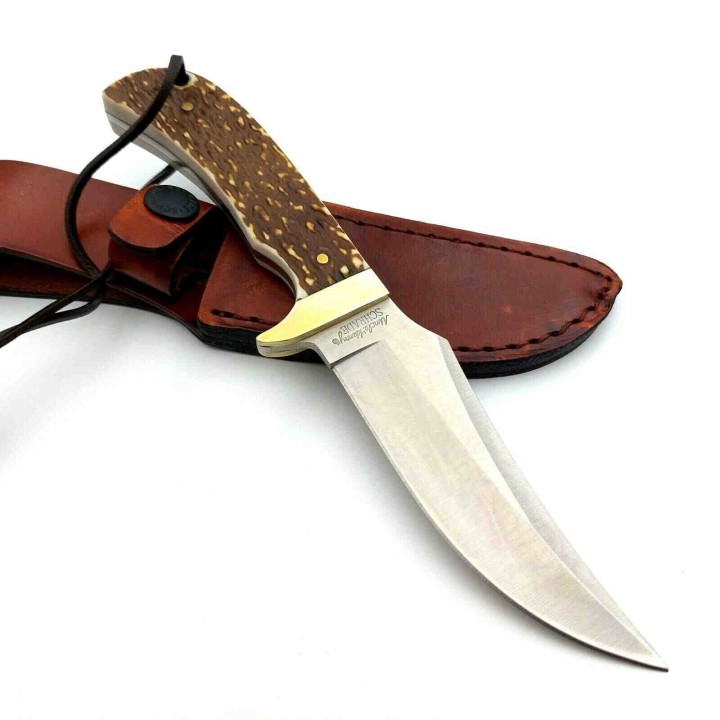 Couteau Schrade Uncle Henry Skinner Acier 7Cr17MoV Manche Delrin Façon Bois de Cerf Etui Cuir SCH1100034 - Livraison Gratuite