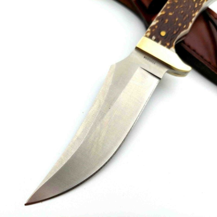Couteau Schrade Uncle Henry Skinner Acier 7Cr17MoV Manche Delrin Façon Bois de Cerf Etui Cuir SCH1100034 - Livraison Gratuite