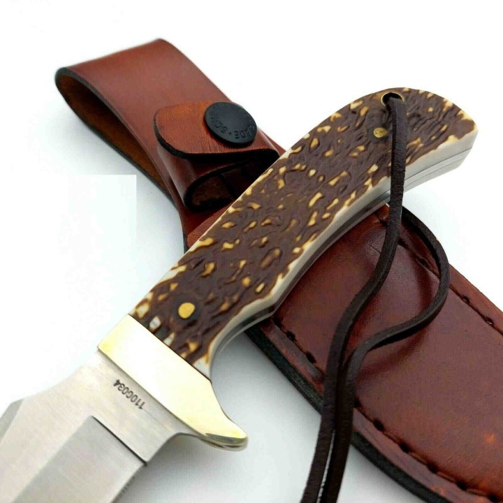 Couteau Schrade Uncle Henry Skinner Acier 7Cr17MoV Manche Delrin Façon Bois de Cerf Etui Cuir SCH1100034 - Livraison Gratuite