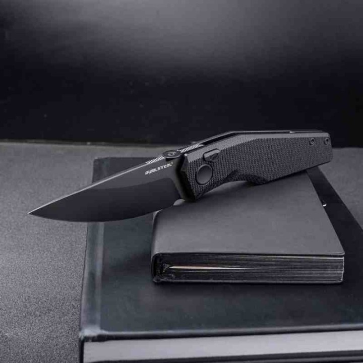 Couteau Real Steel Spectrum Black Lame Acier Nitro V Black Manche G10 IKBS Button Lock RS7142BB - Livraison Gratuite